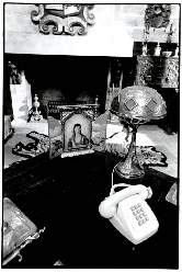 The set for Lavalliere's study with the tryptich of Agnes de Beauvioir on his desk